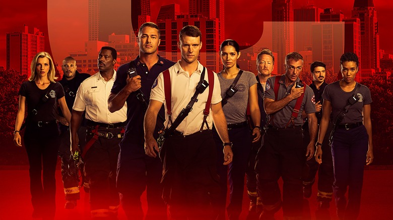 The cast of Chicago Fire walking toward the camera, tinted red