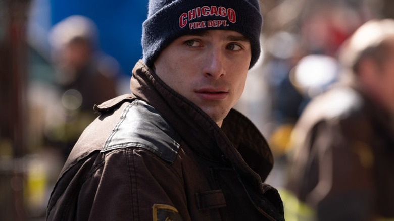Michael Bradway as Jack Damon in a coat and Chicago Fire Dept. hat on Chicago Fire