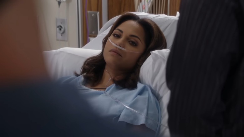 Monica Raymund as Gabriela Dawson laying in a hospital bed on Chicago Fire