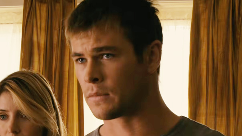 Chris Hemsworth as Sam looking worried in Ca$h