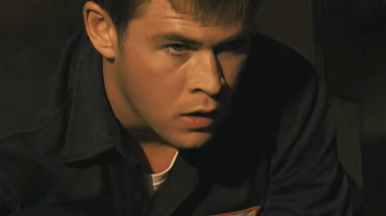Chris Hemsworth as Sam looking worried in Ca$h