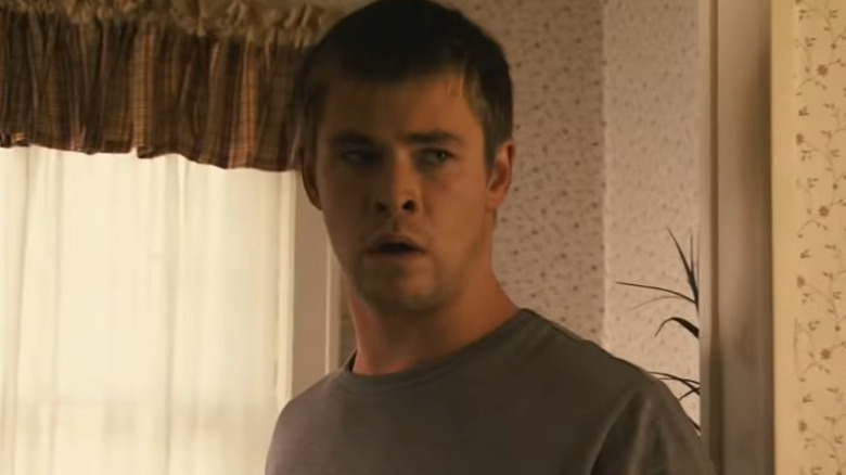 Chris Hemsworth as Sam with a look of shock on his face in Ca$h