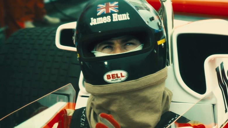 Chris Hemsworth as James Hunt sitting in the cockpit of his car in Rush