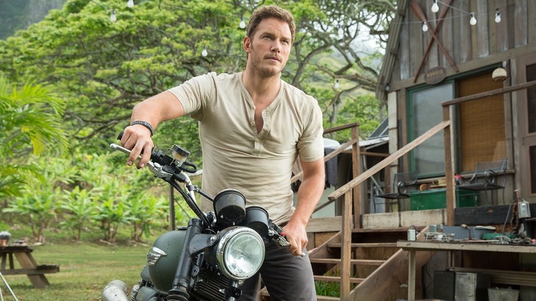 Chris Pratt as Owen Grady getting on his motorcycle in Jurassic World