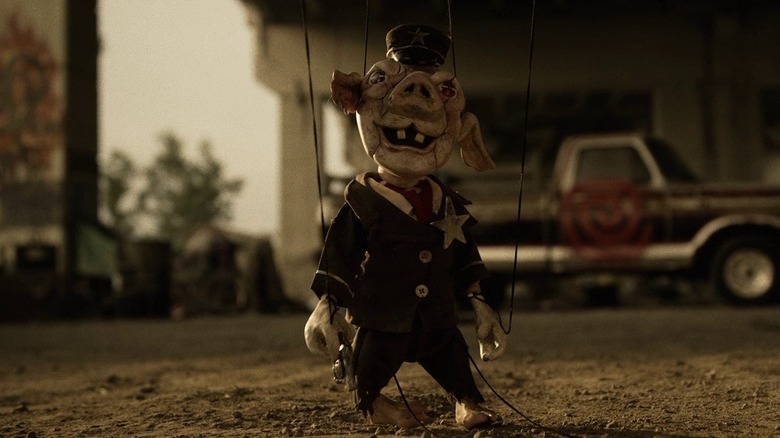 The pig puppet standing upright in Spiral: From the Book of Saw