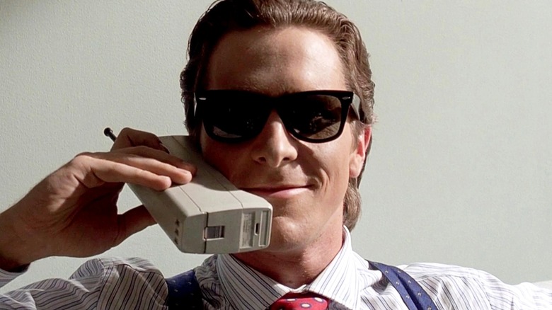 American Psycho Patrick Bateman sitting on couch in style