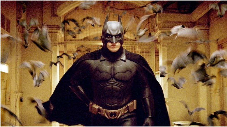 Batman Begins running through bat swarm