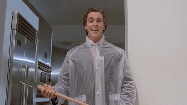 American Psycho Christian Bale head on laughing with axe