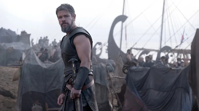 Odysseus and his men arriving at a beach ready for battle in The Odyssey (2026)