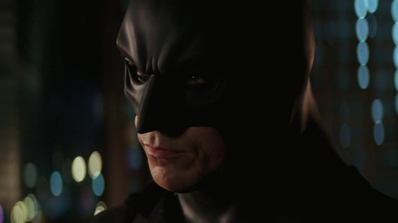 Christian Bale as Batman wearing his mask in Batman Begins