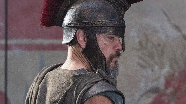 Matt Damon as Odysseus stands looking to his right in The Odyssey