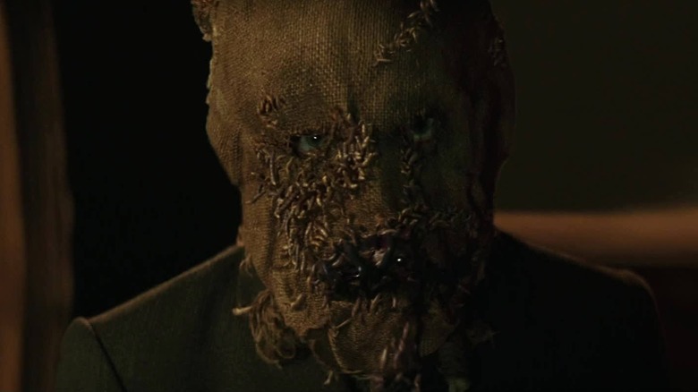 Cillian Murphy as Scarecrow in his mask in Batman Begins