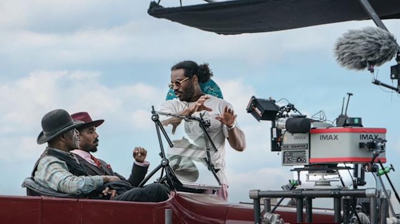 Ryan Coogler directs Michael B. Jordan and Delroy Lindo on the set of Sinners