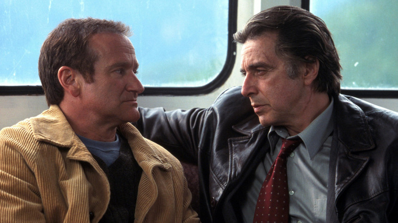 Dormer and Finch staring at each other on a ferry in Insomnia