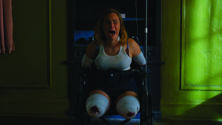 Nica from Chucky screaming in a wheelchair