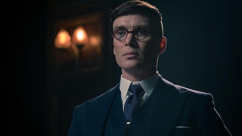 Tommy Shelby (Silian Murphy) wears glasses and appears dangerous in the cloudy cloudy