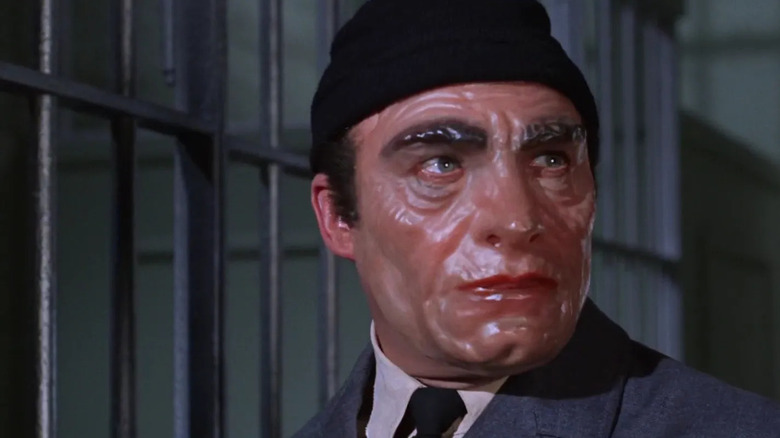 False Face wearing a knit cap on Batman