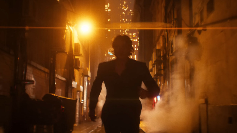 Tom Rhys Harries as Matt Hagen running down an alley in Gotham City in Clayface