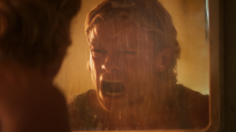 Tom Rhys Harries as Matt Hagen screaming at his reflection in a mirror in Clayface