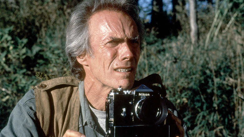 Robert Kincaid using his camera in The Bridges of Madison County