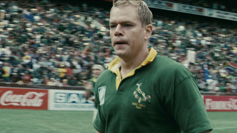Matt Damon's Francois Pienaar looks tired as he stands on a rugby field in Invictus