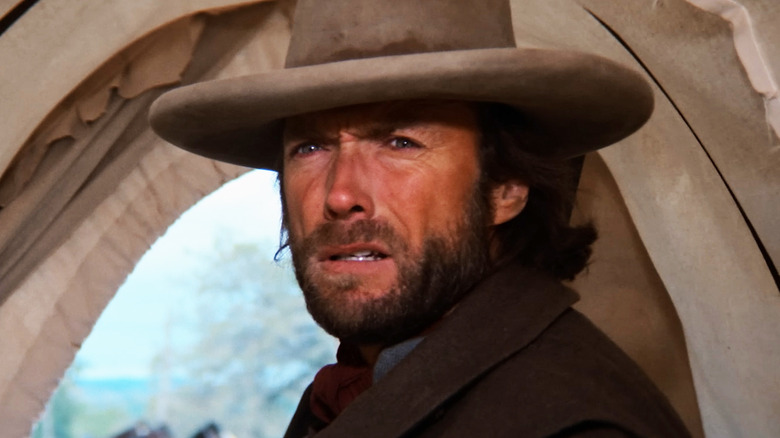 Clint Eastwood's Josey Wales looks confused as he stands in a tent in The Outlaw Josey Wales