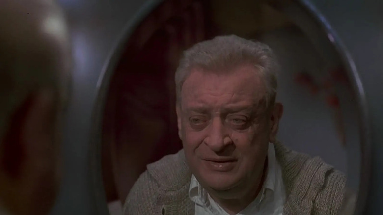 Rodney Dangerfield looking into a mirror in Casper
