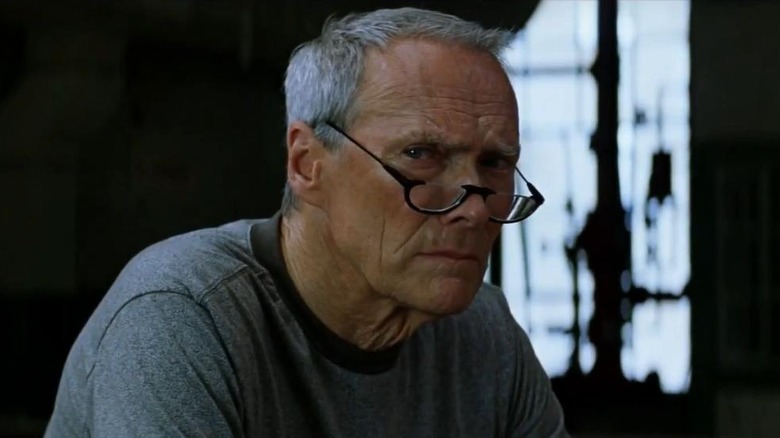 Clint Eastwood peering over reading glasses