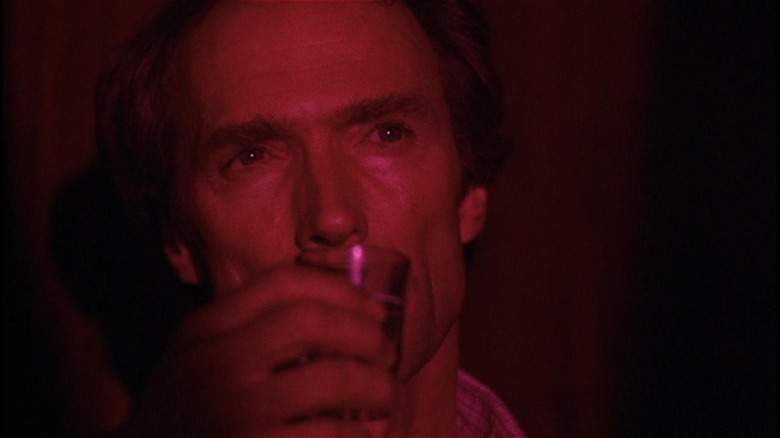 Clint Eastwood drinking in a strip club