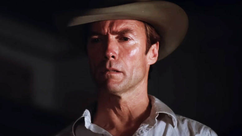 Clint Eastwood's Red Stovall stands in shadow wearing a hat in Honkeytonk Man