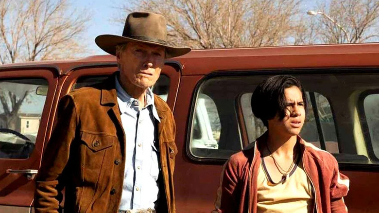 Clint Eastwood's Mike Milo and Eduardo Minett's Rafo standing beside a red truck on Cry Macho