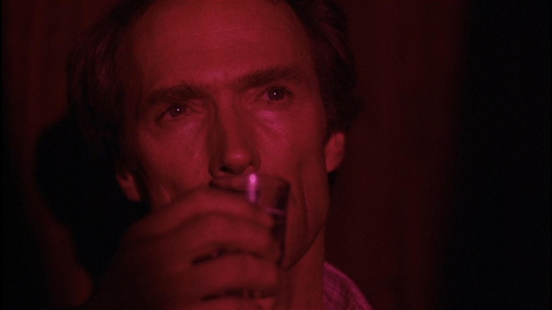 Clint Eastwood drinking in a strip club