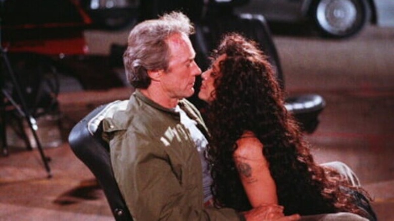 Sonia Braga astride Clint Eastwood in The Rookie