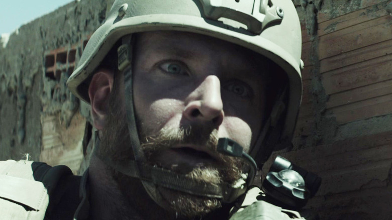 Bradley Cooper's Chris Kyle looks shocked while on duty in American Sniper