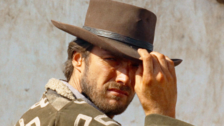 Clint Eastwood's Man with No Name tips his hat in closeup in A Fistful of Dollars