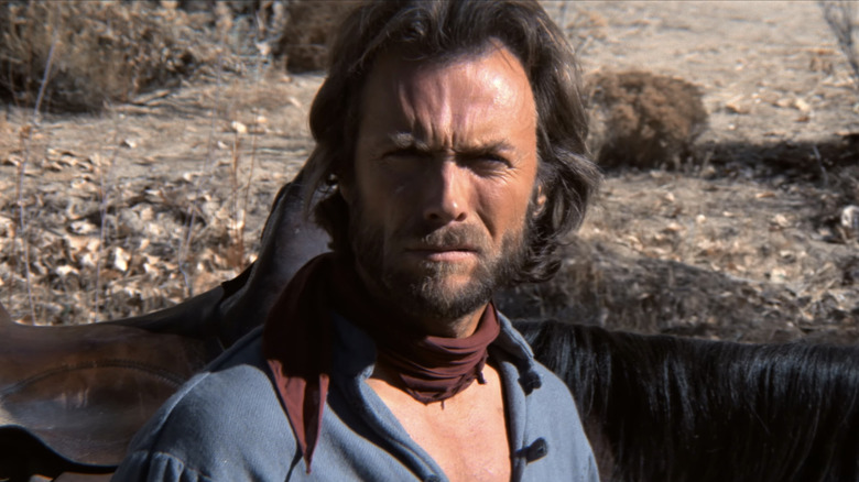 Clint Eastwood's Josey Wales is seen in closeup as he stands by his horse in The Outlaw Josey Wales