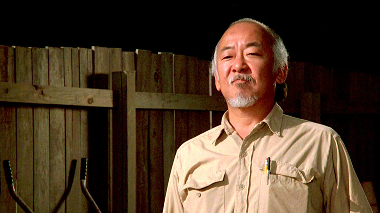 Mr. Miyagi standing outside in The Karate Kid