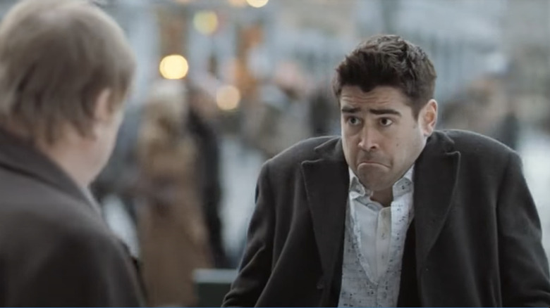 In Bruges Colin Farrell as Ray shrugging and frowning