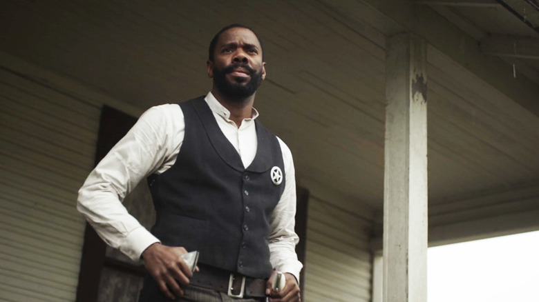 Colman Domingo's Bass Reeves stands on the steps of his home in Timeless
