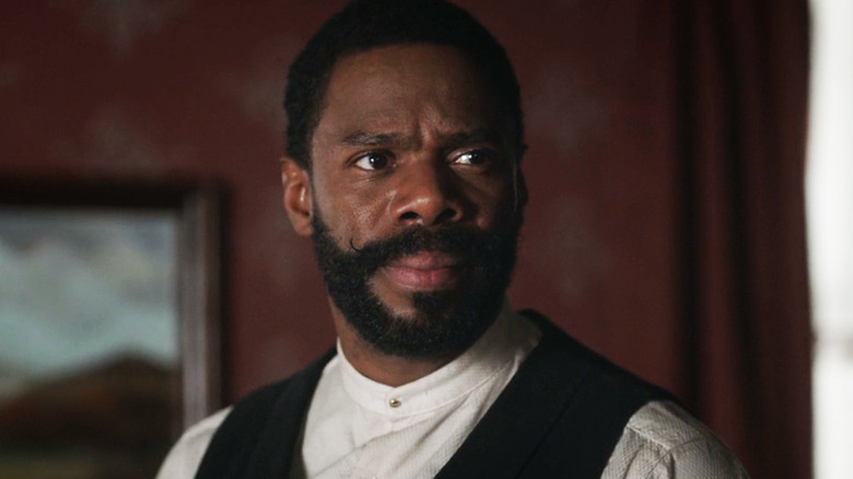 Colman Domingo's Bass Reeves is seen in closeup as he stands in his living room in Timeless