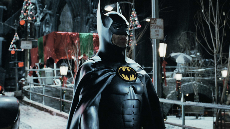 Michael Keaton's Batman stands on a snowy Gotham street in Batman Returns