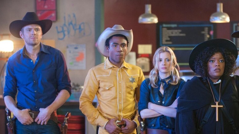 Jeff, Troy, Britta, and Shirley dressed in Western gear in Community