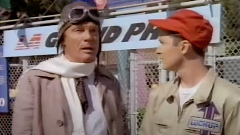 Ty Lookwell in an old-timey racing uniform, at a racetrack in Lookwell