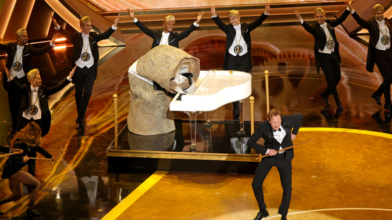 Conan O'Brien dancing while the sandworm from Dune: Part Two plays piano at the 2025 Oscars