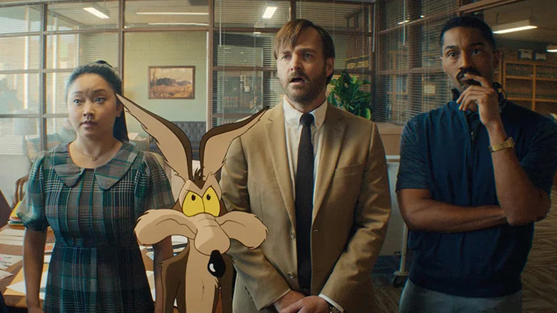Paige, Coyote, Kevin Avery, and Sal looking at something in a law office in Coyote vs. Acme