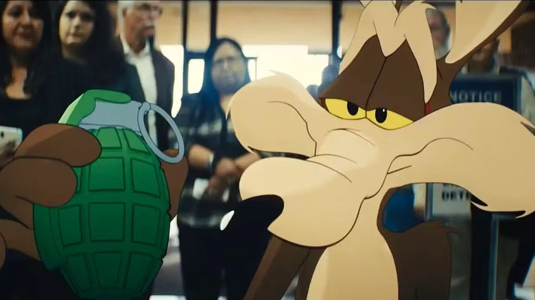 Wile E. Coyote looking closely at a hand grenade in Coyote vs. Acme