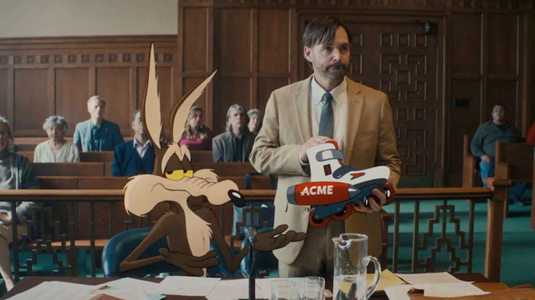 Wile E. Coyote in court next to Kevin Avery holding a rocket skate in Coyote vs. Acme
