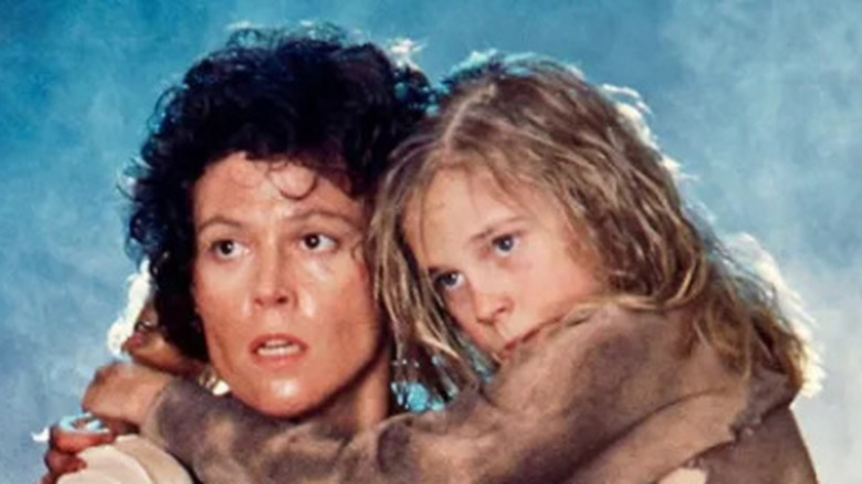 Promotional photo of Ripley (Sigourney Weaver) and Newt (Carrie Henn) for Aliens (1986)