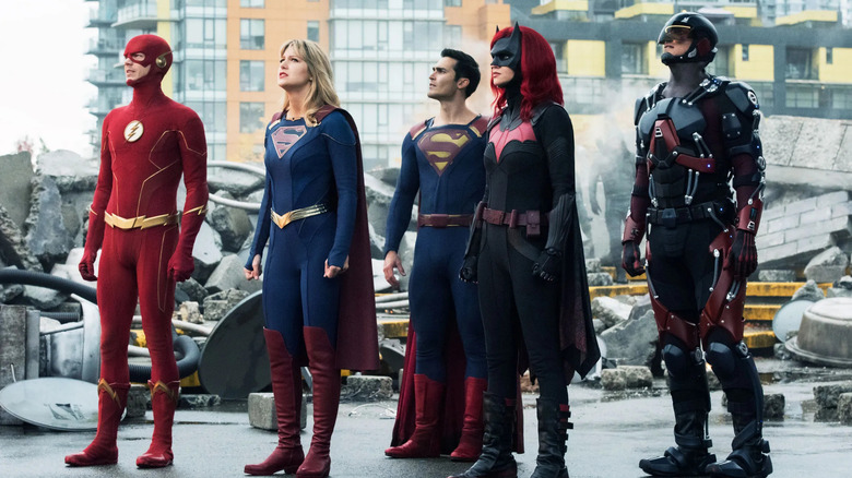 The Flash, Supergirl, Superman, Batwoman, and The Atom standing together in Crisis on Infinite Earths