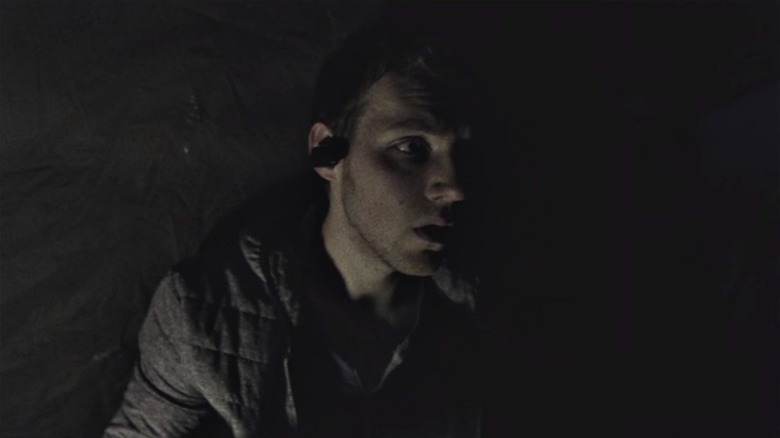 James Allen McCune half in darkness